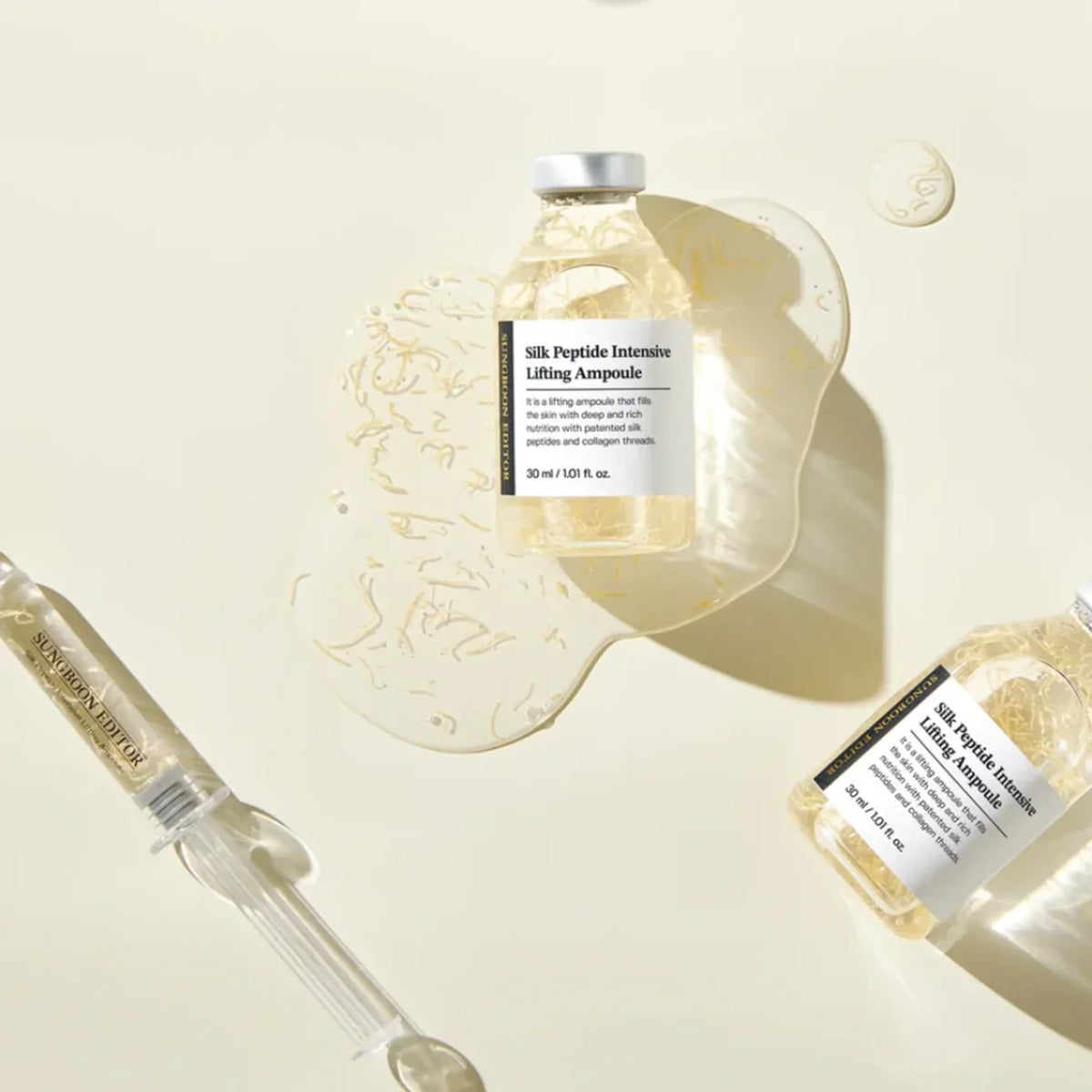 Texture du sérum coréen aux peptides de soie : fils de collagène dorés qui fondent sur la peau